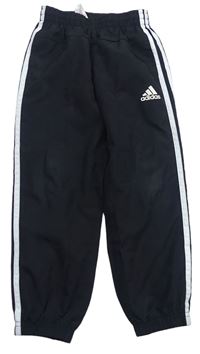 Čierne šušťákové podšité nohavice s logom Adidas