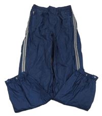 Tmavomodré šušťákové podšité nohavice s proužkem kids