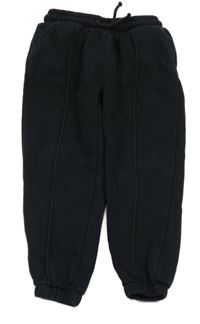 Černé tepláky s puky Tu