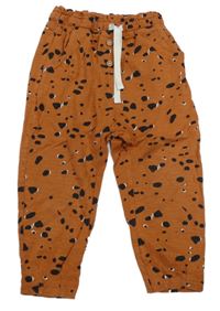 Oranžovo-černé puntíkaté tepláky Next