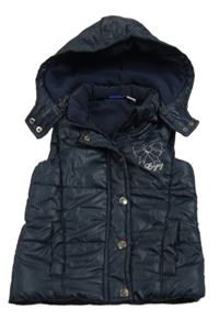 Tmavomodrá šušťáková prešívaná zateplená vesta s mašlou a odopínacíá kapucňou Lupilu