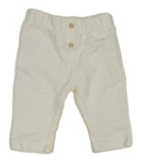 Bílé teplákové kalhoty s knoflíkem Mango