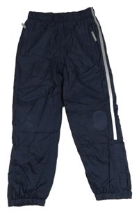 Tmavomodré šusťákové zateplené kalhoty