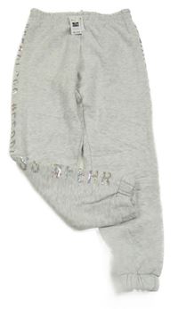 Nové - šedé melírované tepláky s nápisem z flitrů St. Bernard