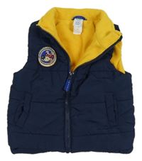 Tmavomodrá šušťáková zateplená vesta s nášivkou C&A