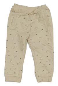 Smetanové teplé tepláky s kytičkami a volánkem ORCHESTRA