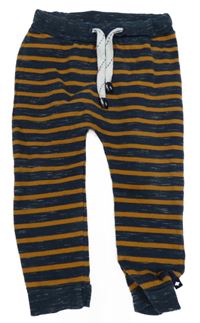 Tmavomodro-hnědé pruhované tepláky 