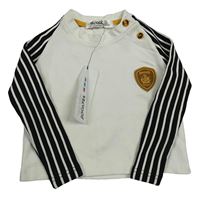 Nové - Smetanovo-černé triko s nášivkou a pruhy na rukávech