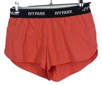 Dámske korálové športové kraťasy s logy Ivy Park