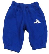 Tmavomodré tepláky s logem Adidas