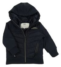 Tmavomodrý prošívaný šusťákovo/softshellový zateplený bomber s nášivkou a kapucí Topolino