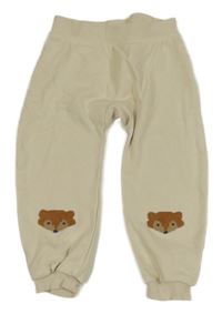 Smotanové tepláky s liškami lupilu