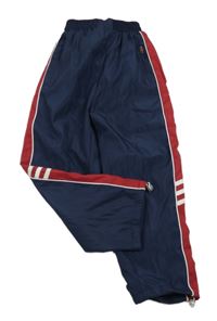 Tmavomodro-červené šušťákové podšité nohavice s pruhmi