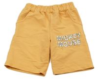 Oranžové teplákové kraťasy s nápisom