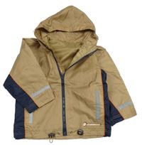 Béžovo-tmavomodrá šusťáková jarní bunda s kapucí