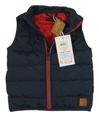 Nové - Tmavomodrá šušťáková prešívaná zateplená vesta Name it