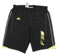 Černo-žluté sportovní funkční kraťasy s pruhy Adidas 