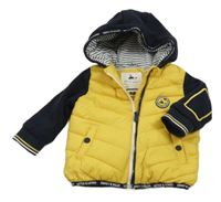 Tmavomodro-žltá šušťáková zateplená bunda s mikinovymi rukávy a kapucňou