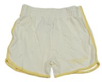 Smetanovo-žlté teplákové kraťasy s nápismi PRIMARK