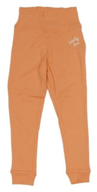 Oranžové lehké tepláky s nápisem