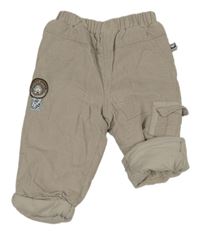 Světlebéžové zateplené manšestráky s nášivkou 