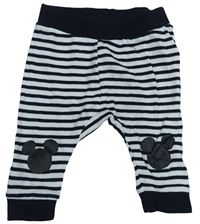 Čierno-biele pruhpvané tepláky s Mickeym zn. Disney