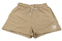 Béžové teplákové kraťasy s nášivkou H&M