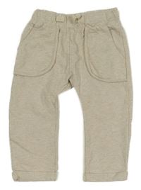 Béžové melírované tepláky s kapsami 