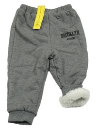 Nové - Šedé melírované zateplené tepláky s nápisem Shein