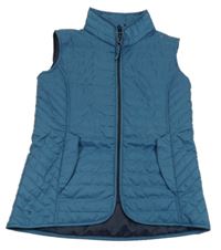 Petrolejová šušťáková jezdecká funkčná vesta Fouganza