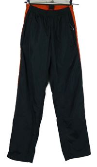 Dámske antracitovo-oranžové šušťákové nohavice James&Nicholson