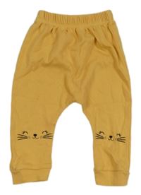 Žluté lehké tepláky s kočkami