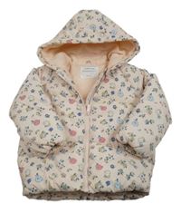 Světlebroskvová prošívaná šusťáková zimní bunda s kytičkami a kapucí PRIMARK