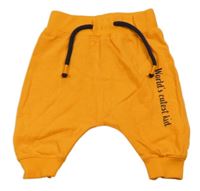 Oranžové baggy tepláky s nápisom