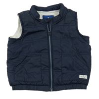 Tmavomodrá prešívaná šušťáková zteplená vesta TOM TAILOR