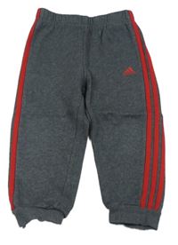 Tmavošedé tepláky s pruhy Adidas