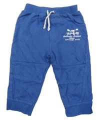 Tmavomodré melírované tepláky s nápisem M&Co.