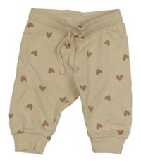 Béžové tepláky so srdiečkami H&M
