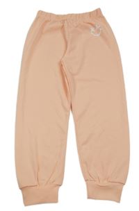 Broskvové športové nohavice so smajlíkom