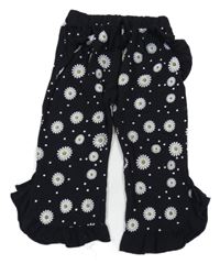 Čierne culottes kvetované nohavice s volánikmi