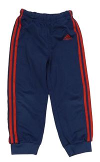 Tmavomodré sportovní tepláky s logem Adidas