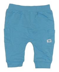 Azurové baggy tepláky s nášivkou Dunnes