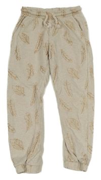 Světlebéžové tepláky se zlatými pírky 