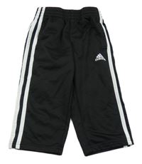 Čierno-biele športové tepláky s pruhmi a logom Adidas