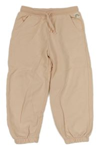 Meruňkové tepláky Next