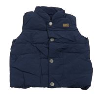 Tmavomodrá šušťáková zateplená vesta Next