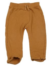 Oranžové baggy tepláky Tu