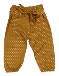 Medovo-bílé puntíkaté kalhoty s mašlí 