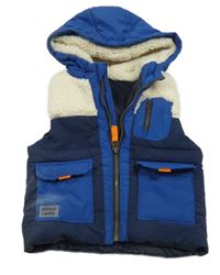 Bílo-tmavomodrá šusťákovo/huňatá zateplená vesta s kapucí 