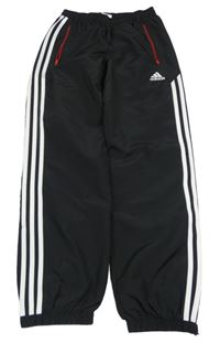 Černé šusťákové kalhoty s pruhy Adidas 